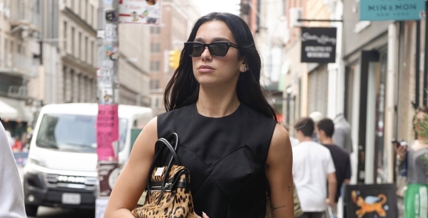 Pop star Dua Lipa is seen walking in Soho with friends after enjoying coffee Café Leon Dore in New York wearing a cartier watch and tiffany ring. 