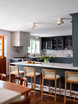 A kitchen with a breakfast bar