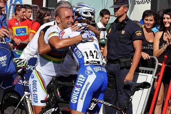 Warm embrace: Paolo Bettini and Quick Step team-mate Tom Boonen celebrate the victory.