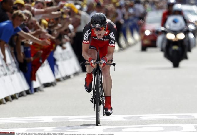 A punishing ride in the time trial saw Cadel Evans (BMC) move into the yellow jersey and secure his Tour de France victory