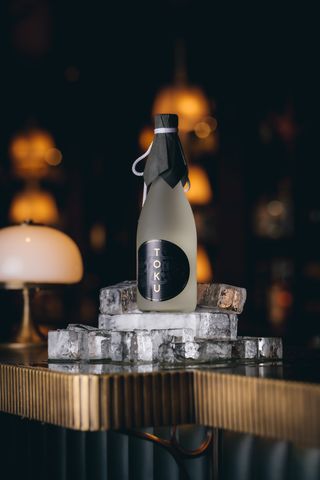 Bottle of Toku Sake on ice