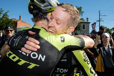 New 2020 Australian road race champion Cameron Meyer receives the congratulations of Mitchelton-Scott teammate Michael Hepburn