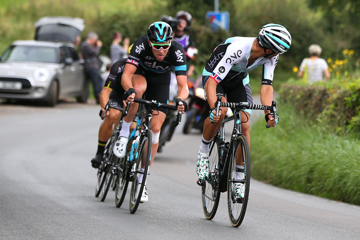 Kristian House (One Pro Cycling) checks on his breakaway companions