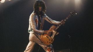 Jimmy Page performs with Led Zeppelin