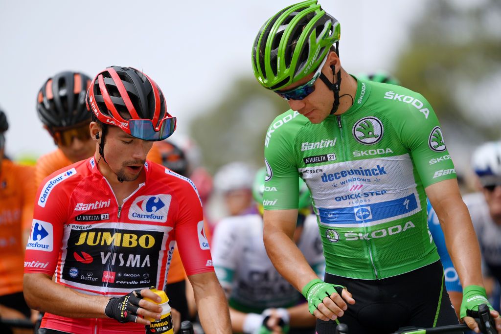 VELEFIQUE SPAIN AUGUST 22 LR Primoz Roglic of Slovenia and Team Jumbo Visma red leader jersey and Fabio Jakobsen of Netherlands and Team Deceuninck QuickStep green points jersey prepare for the race prior to the 76th Tour of Spain 2021 Stage 9 a 188 km stage from Puerto Lumbreras to Alto de Velefique 1800m lavuelta LaVuelta21 on August 22 2021 in Velefique Spain Photo by Stuart FranklinGetty Images