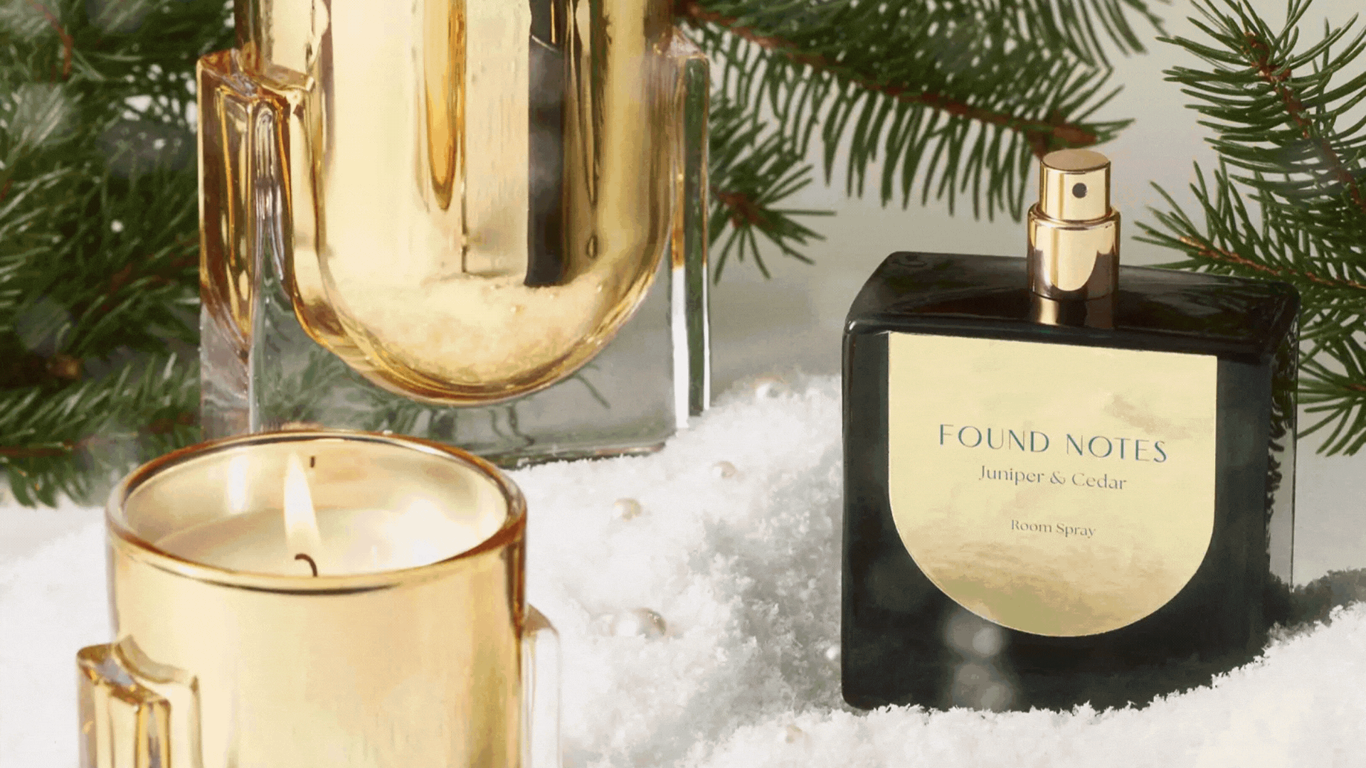 A GIF of wood-scented home fragrance candles, diffusers, and room sprays