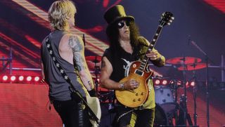 Duff McKagan (left) and Slash perform onstage