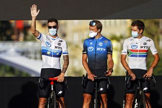 New European road race champion Giacomo Nizzolo, Edvald Boasson Hagen and South African road race champion Ryan Gibbons of NTT Pro Cycling enjoy the fans’ applause