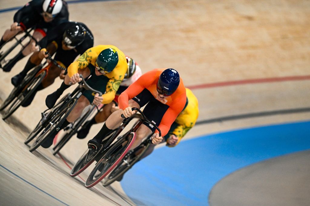 Netherlands' Harrie Lavreysen (R) competes in the men's track cycling keirin final for gold of the Paris 2024 Olympic Games at the Saint-Quentin-en-Yvelines National Velodrome in Montigny-le-Bretonneux, south-west of Paris, on August 11, 2024. (Photo by SEBASTIEN BOZON / AFP)
