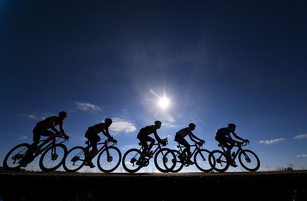 AGUILAR DE CAMPOO SPAIN OCTOBER 29 Santiago Buitrago Sanchez of Colombia and Team Bahrain Mclaren Scott Davies of The United Kingdom and Team Bahrain Mclaren Aliaksandr Riabushenko of Belarus and UAE Team Emirates Ian Garrison of The United States and Team Deceuninck QuickStep Peloton Silhouette during the 75th Tour of Spain 2020 Stage 9 a 1577km stage from Cid Campeador Military Base Castrillo del Val to Aguilar de Campoo lavuelta LaVuelta20 on October 29 2020 in Aguilar de Campoo Spain Photo by Justin SetterfieldGetty Images