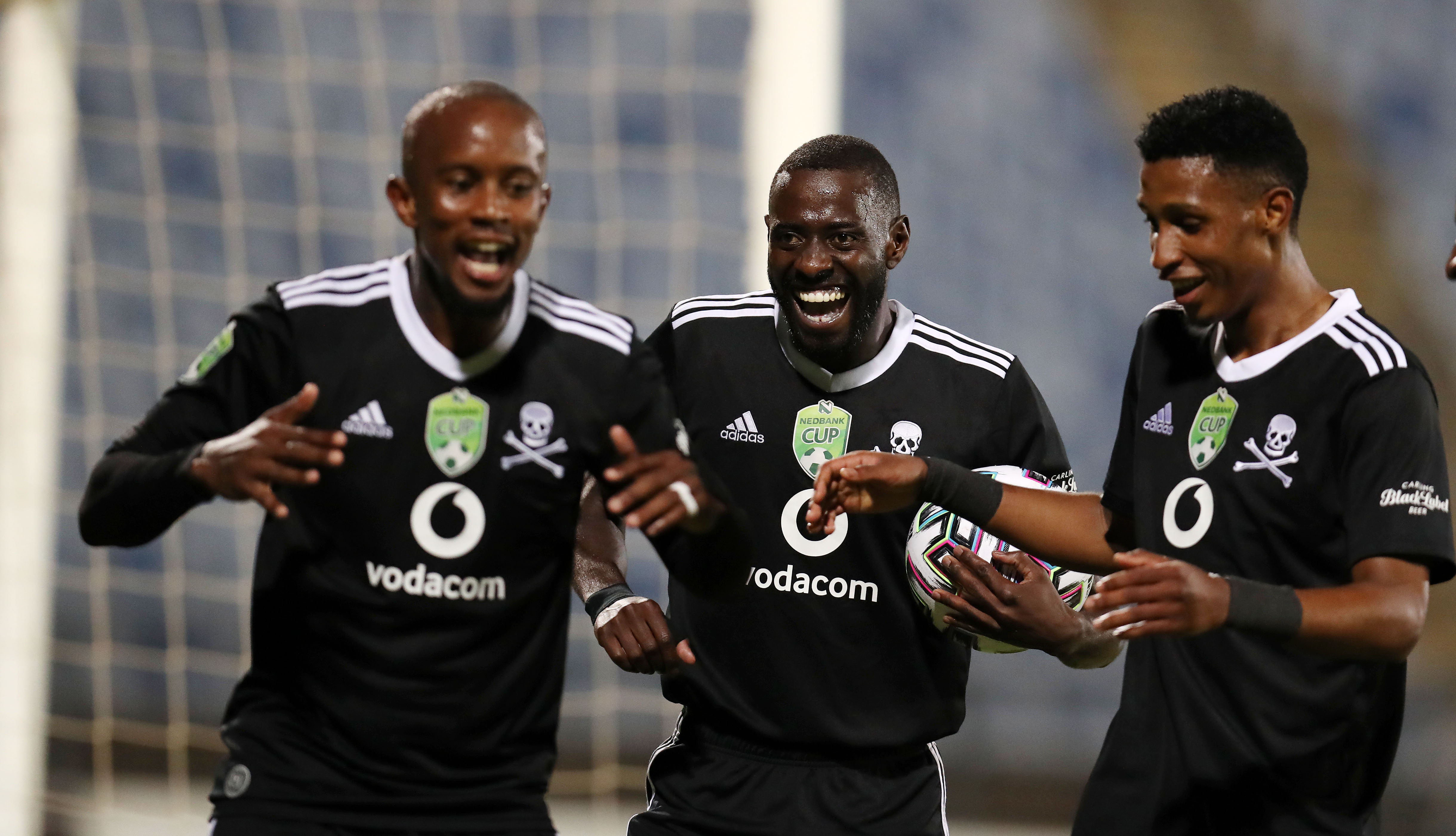 Deon Hotto celebrates his goal with Linda Mntambo and Vincent Pule