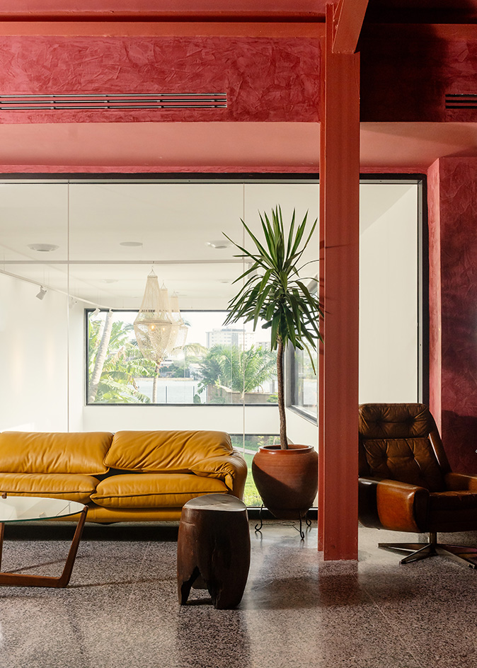 interiors at Mbari Kola, with design led furniture and art seen on walls