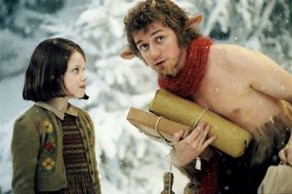 Georgie Henley as Lucy Pevensie faces James McAvoy as the fawn Mr. Tumnus in the snow in The Chronicles of Narnia: The Lion, The Witch, and The Wardrobe