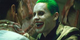 Jared Leto as Joker laughing in someone's face in David Ayer's Suicide Squad