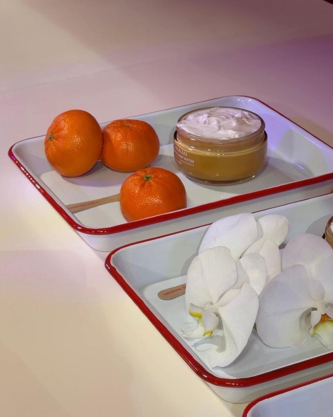 A display showcasing Josie Maran body butter.