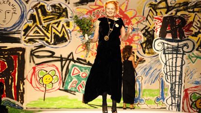 Vivienne Westwood on runway with handdrawn background