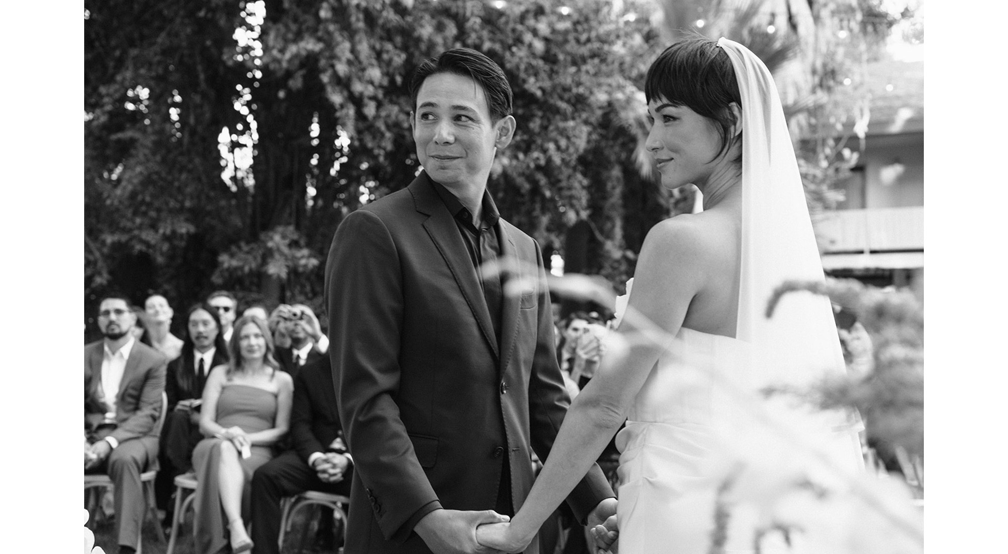 Britni and Sean holding hands.