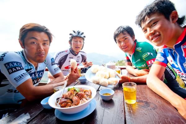 Riders have lunch at a Chinese restrant