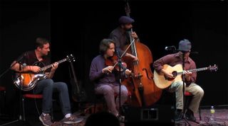 A photo showing tenor guitarists taken at one of the Tenor Guitar Foundation's annual Tenor Guitar Gatherings