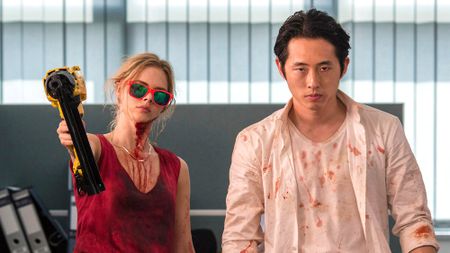 Samara Weaving and Steven Yeun in Mayhem (2017)