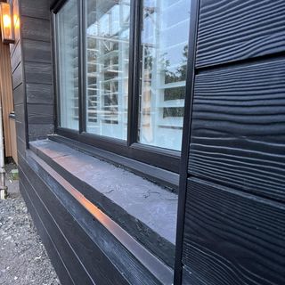 exterior cladding on house in dark grey