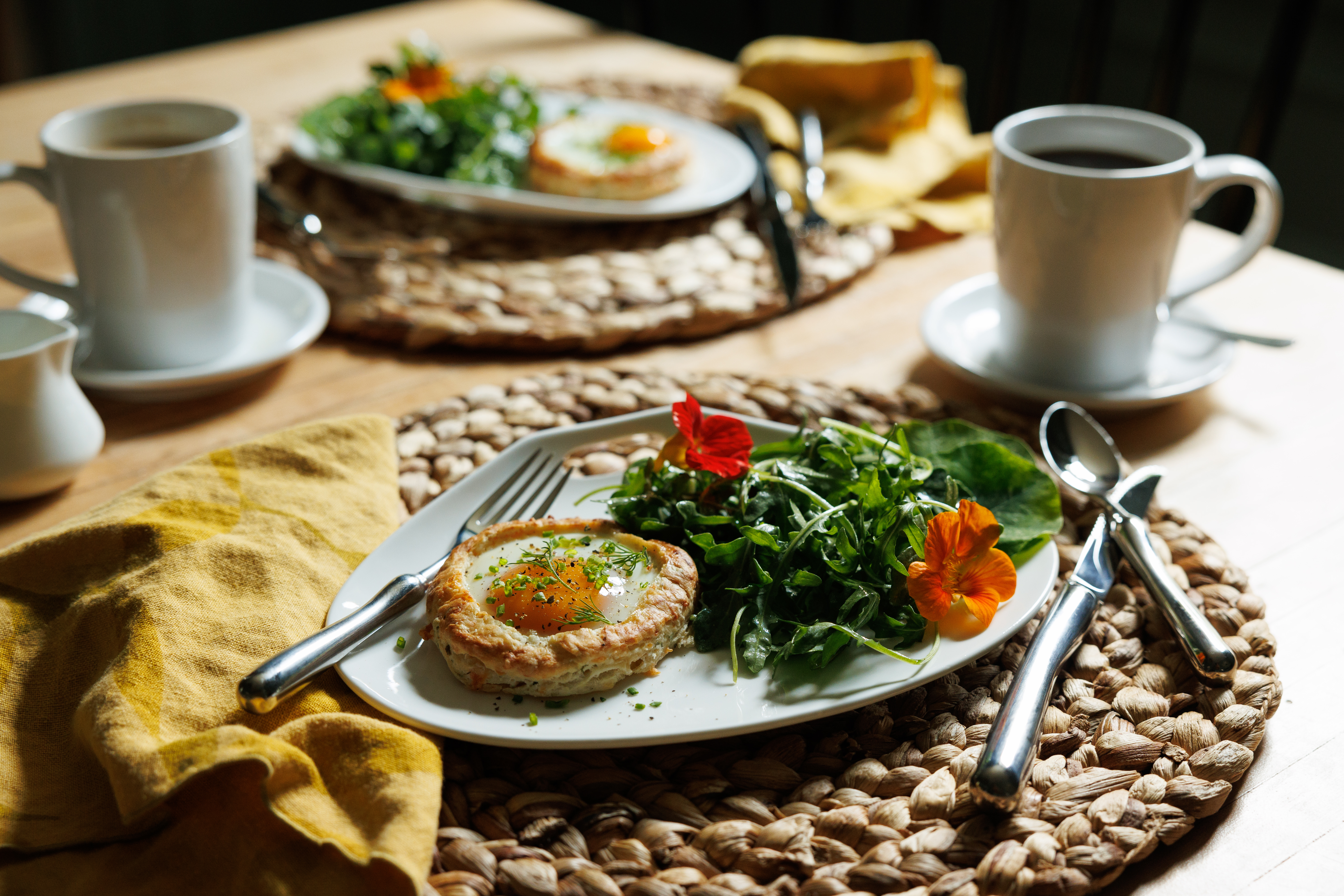 A breakfast plate featuring eggs and salad