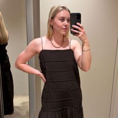 Woman wears brown textured dress from COS summer 2026 collection