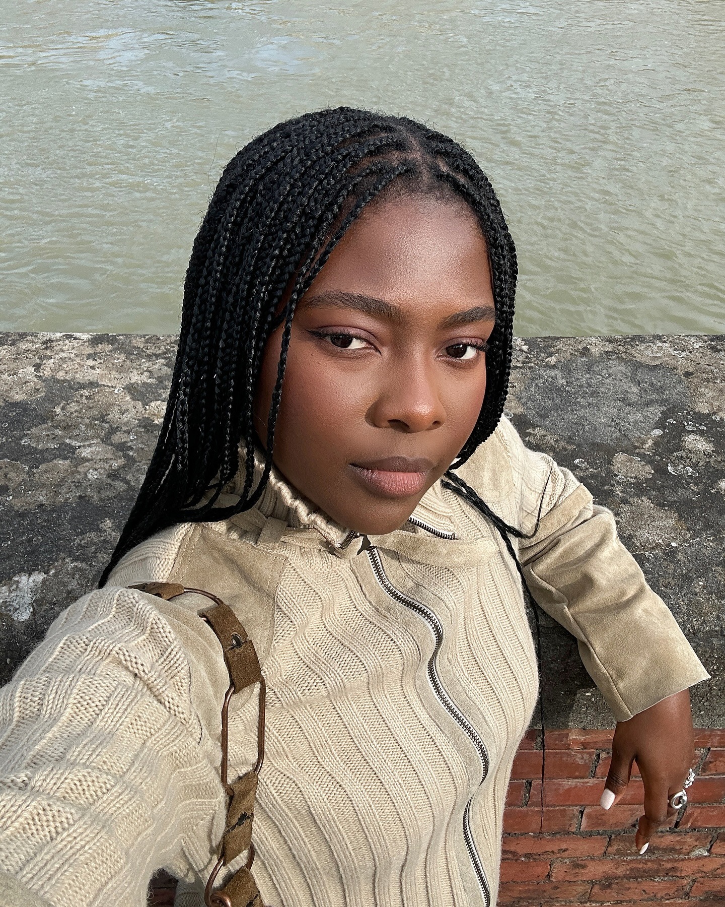 A woman with very smooth skin posing for a selfie.