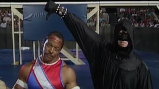 Gemini shows disapproval as the ref gives him a thumbs down in American Gladiators S1 E1.