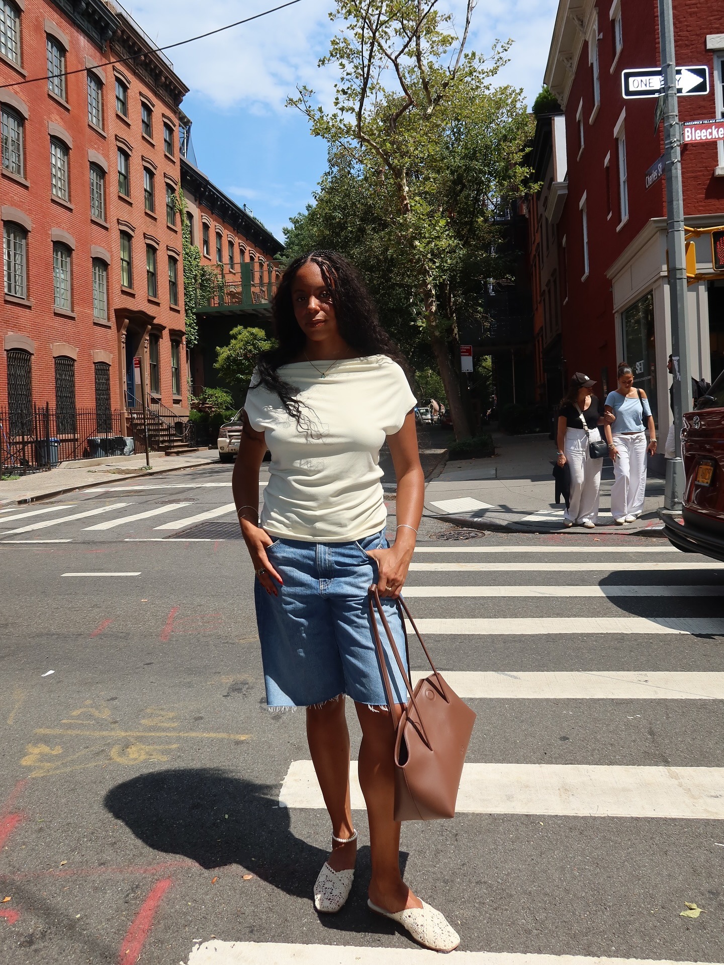 Sierra Mayhew wearing a draped Everlane top