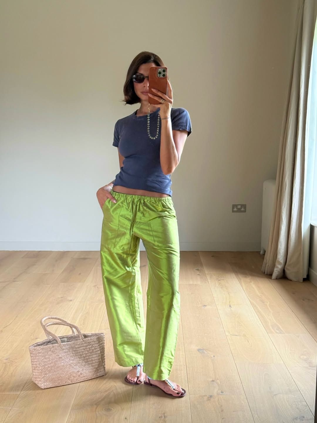 Influencer wearing green taffeta pants