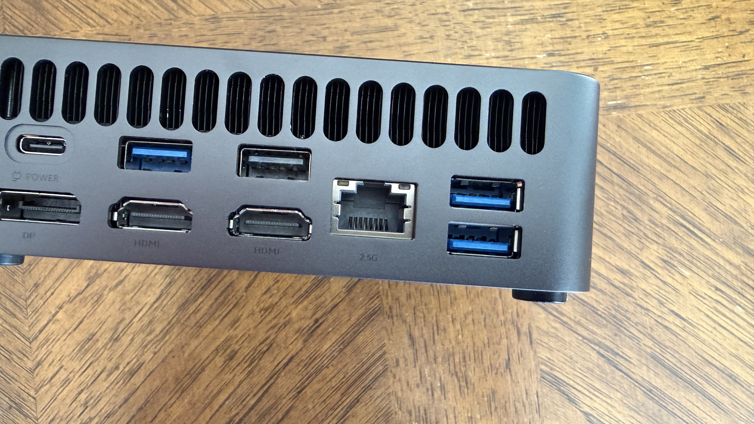 Rear panel of a compact Chuwi mini PC with USB-C, HDMI, Ethernet, and three USB-A ports.