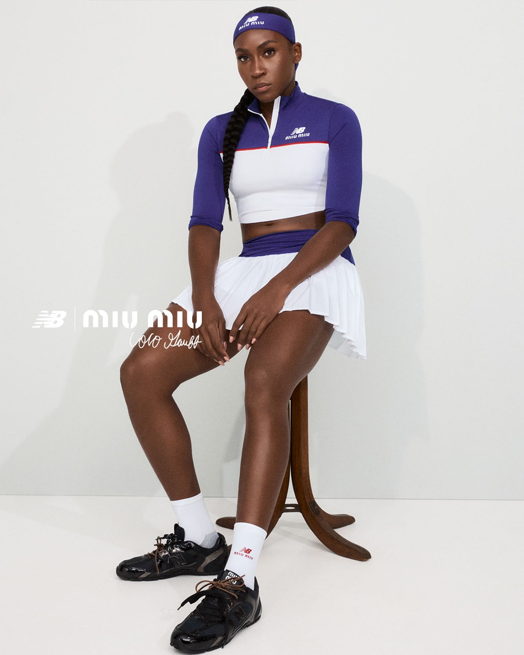 Coco Gauff stars in the campaign for New Balance x Miu Miu with Coco Gauff wearing a purple and white tennis skirt set with white socks, a purple headband, and black sneakers.