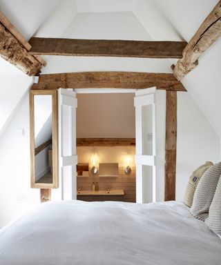 loft conversion bedroom with en suite and exposed beams