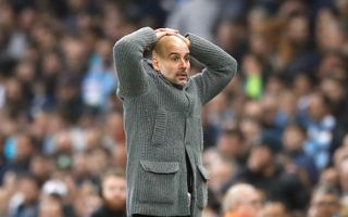 Manchester City manager Pep Guardiola reacts after Raheem Sterling's late goal is ruled out