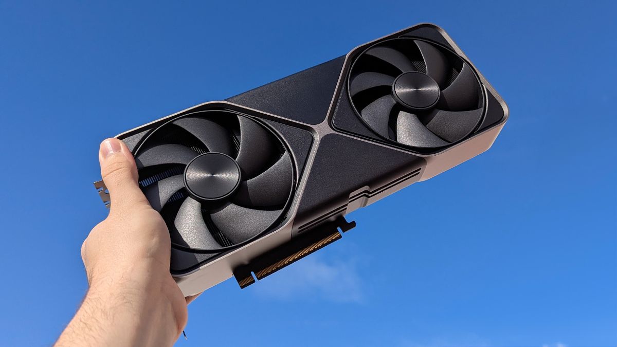 NVIDIA GeForce RTX 5080 Founders Edition held to a blue sky