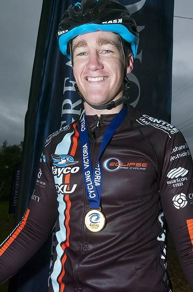Time for some Benny Hill music: Jayco/2xu's Benjamin Hill proudly displays his gold medal from stage five.