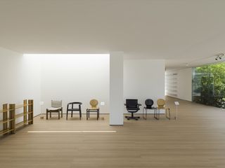 Room with white walls and wooden flooring