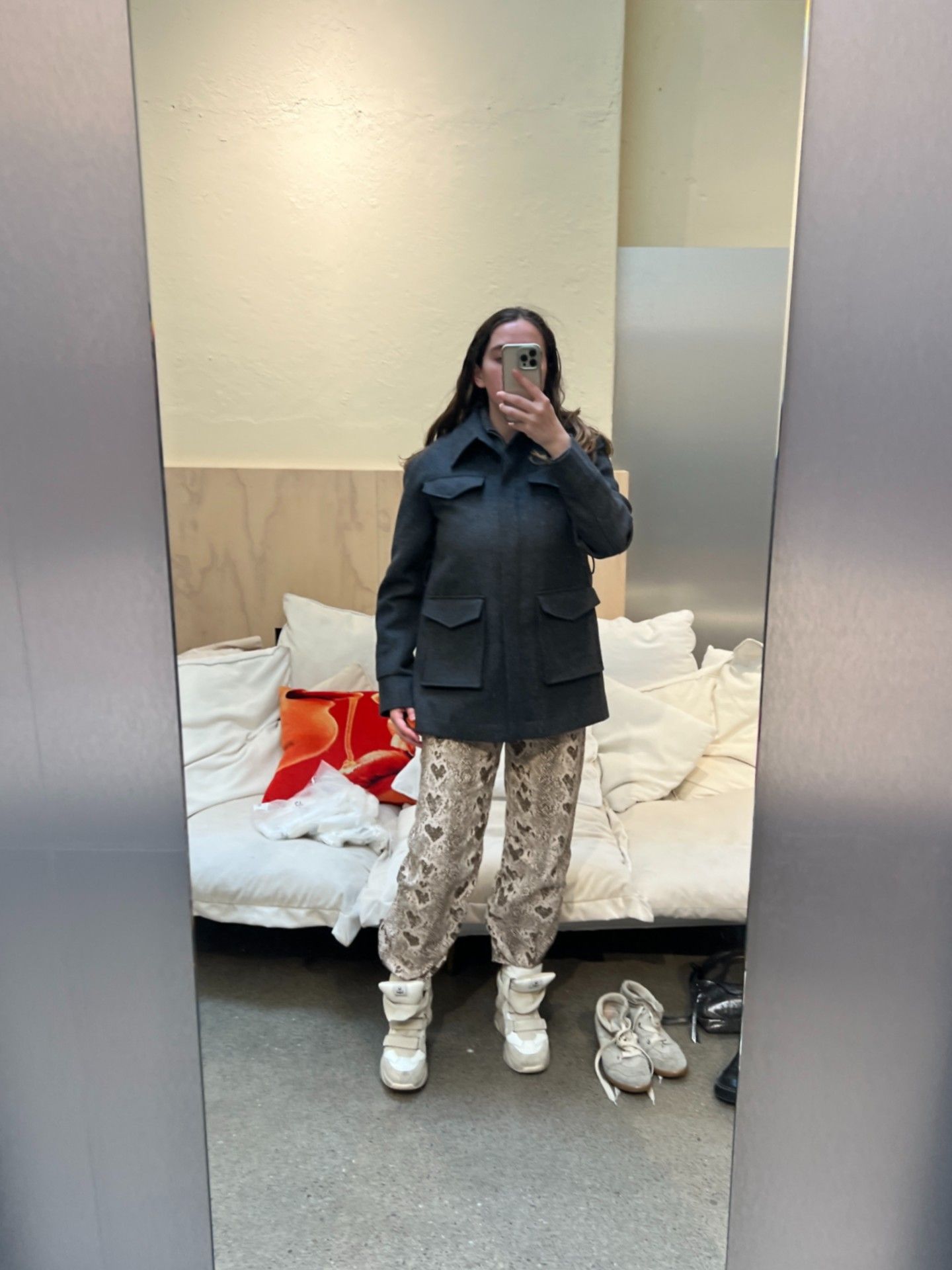 An image of a Who What Wear fashion writer wearing the Isabel Marant wedge trainers.