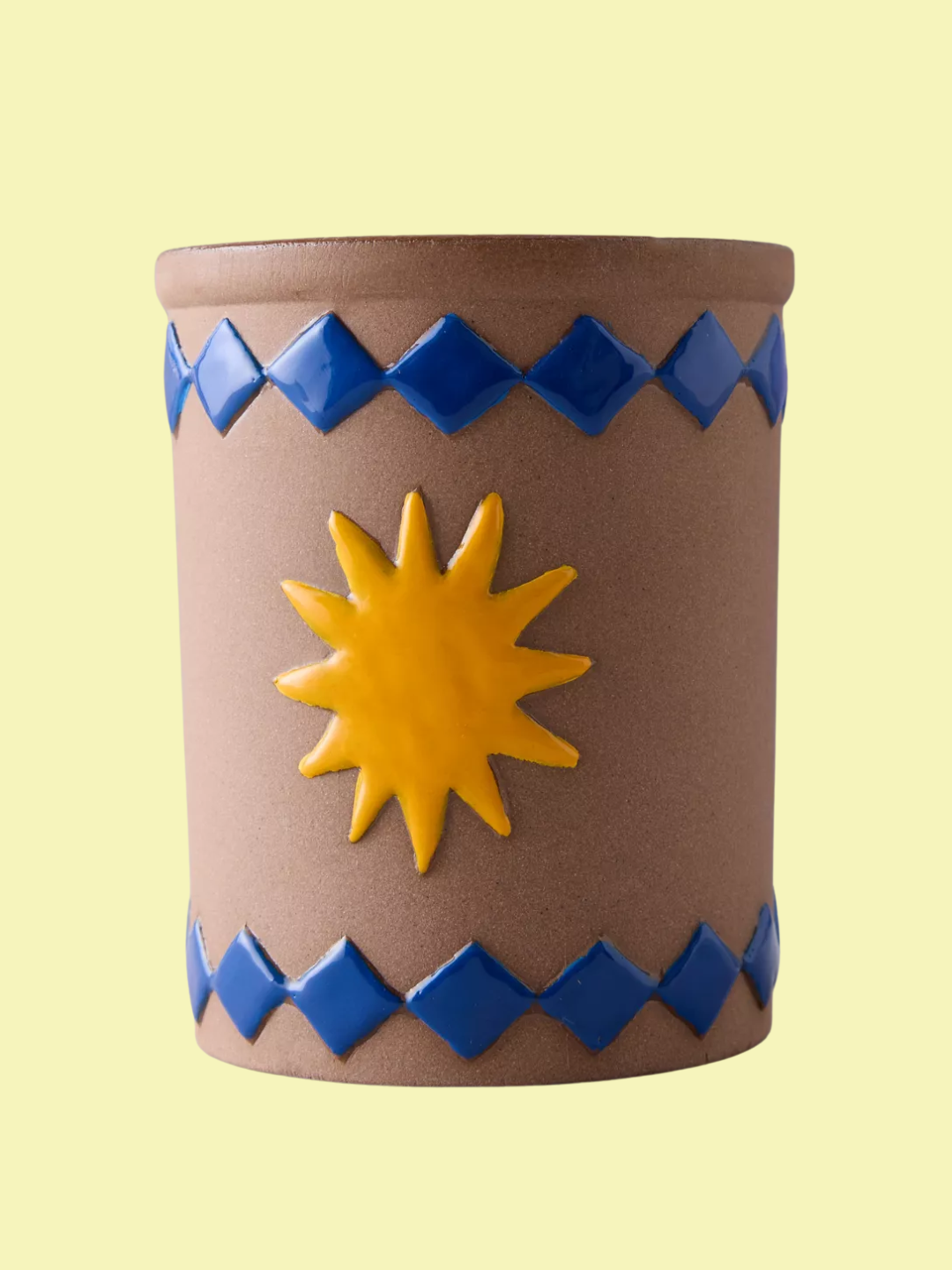 A scented ceramic candle from M&amp;AElig;GEN