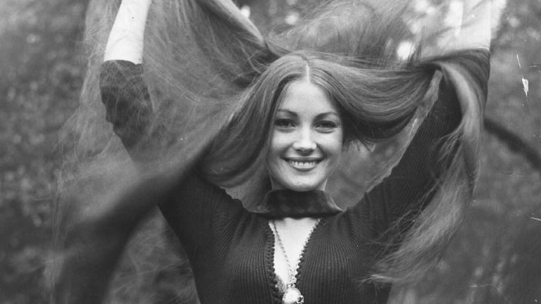 Model and actress Jane Seymour shows off her long tresses in the park, London.