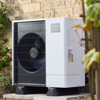 An air-source heat pump attached to a cotswold home