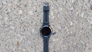 The Wahoo ELEMNT Rival Multisport GPS Watch on a paved floor