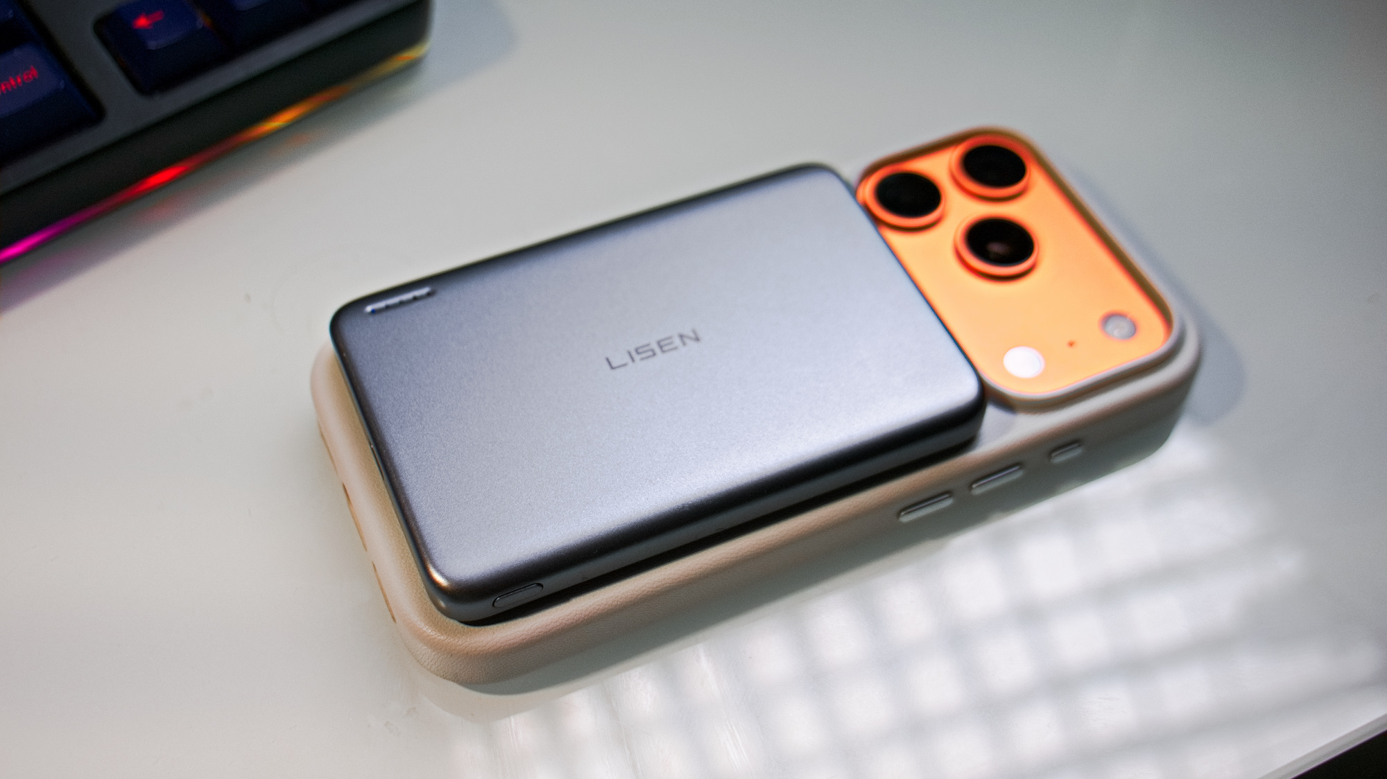 LISEN Qi2 15W Ultra Slim MagSafe Battery connected to an iPhone.