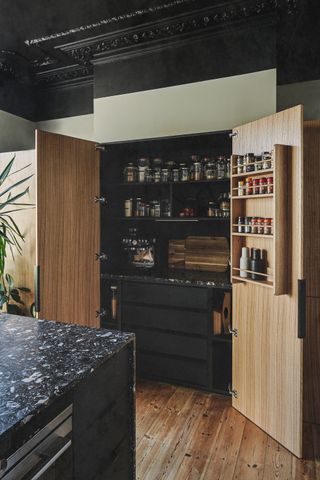 A view inside a built in kitchen pantry