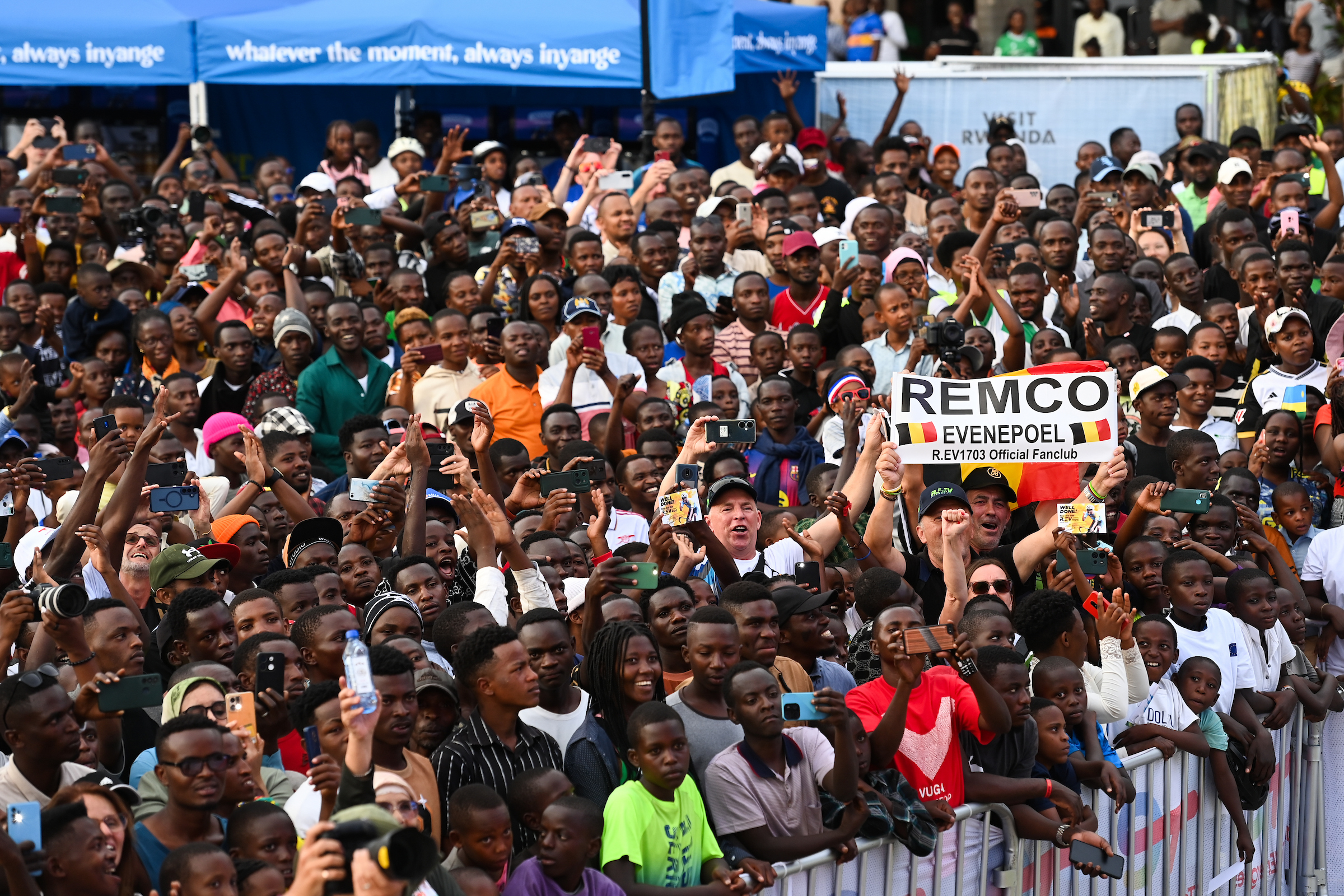 Picture by Simon Wilkinson/SWpix.com - 21/09/2025 - Cycling - 2025 UCI Road World Championships - BK Arena to Kigali Convention Centre, Kigali, Rwanda - Men Elite Individual Time Trial (ITT) Podium - Remco Evenepoel (Belgium) fans in the crowd for the podium ceremony