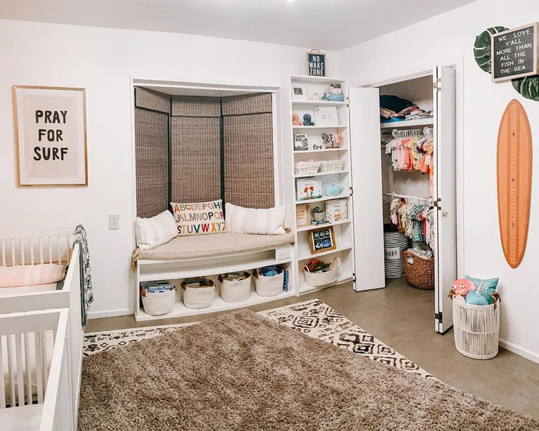 Twin nursery design ideas by Ashli Delavan with reading window seat and bookshelf
