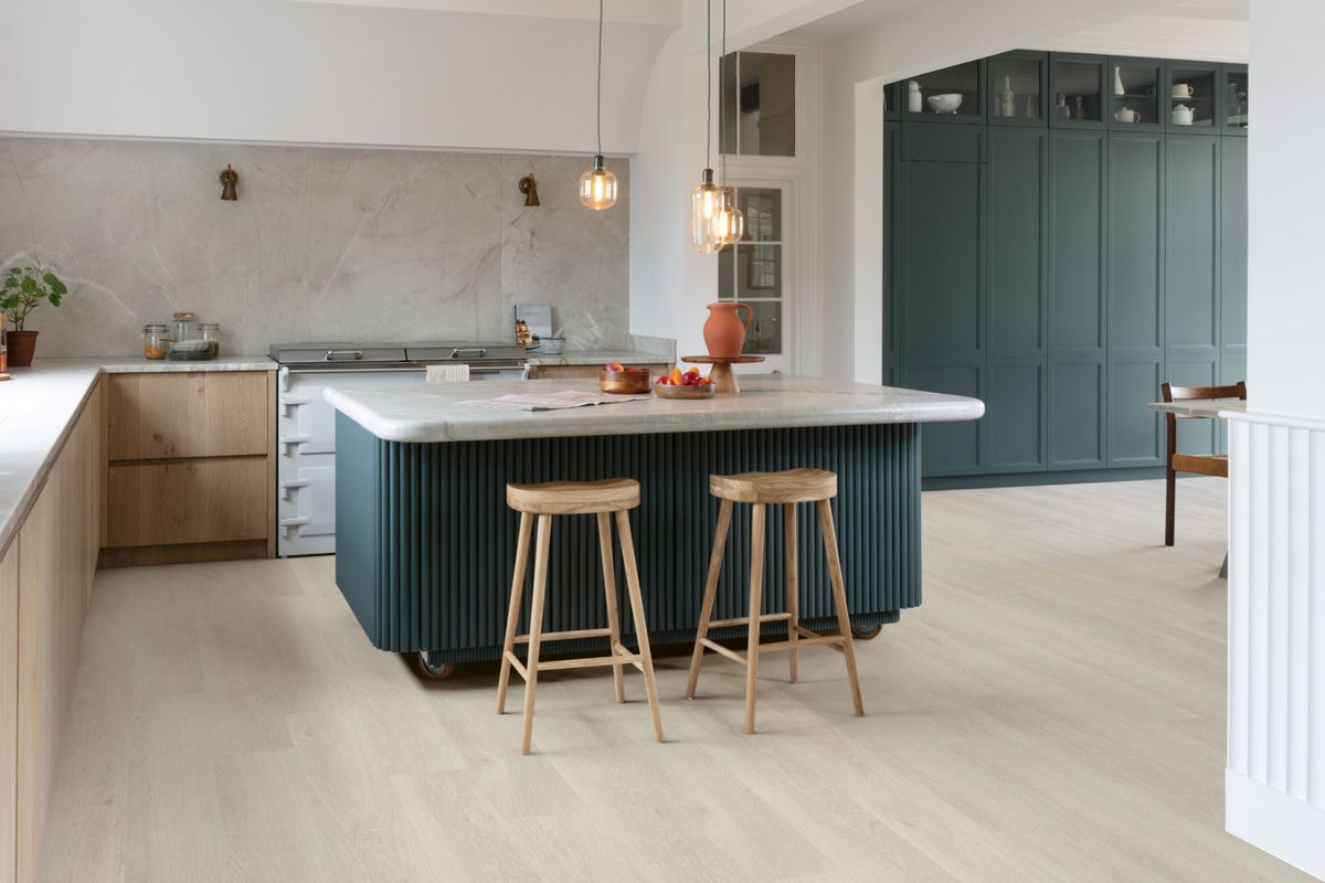 A light neutral toned modern kitchen with vinyl flooring