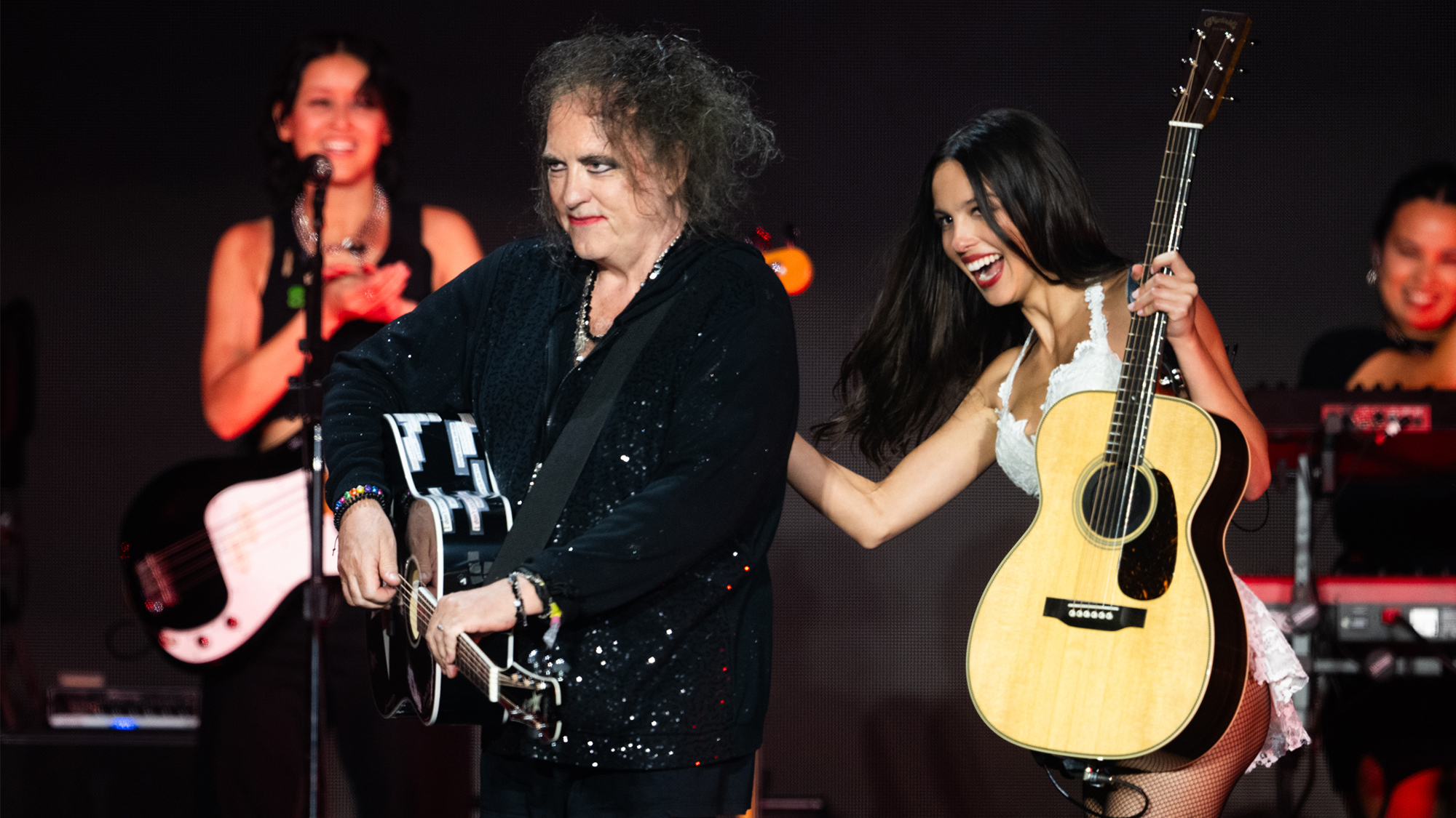 Olivia Rodrigo performs with Robert Smith of The Cure on the Pyramid stage during day five of Glastonbury festival 2025 at Worthy Farm, Pilton on June 29, 2025 in Glastonbury, England.