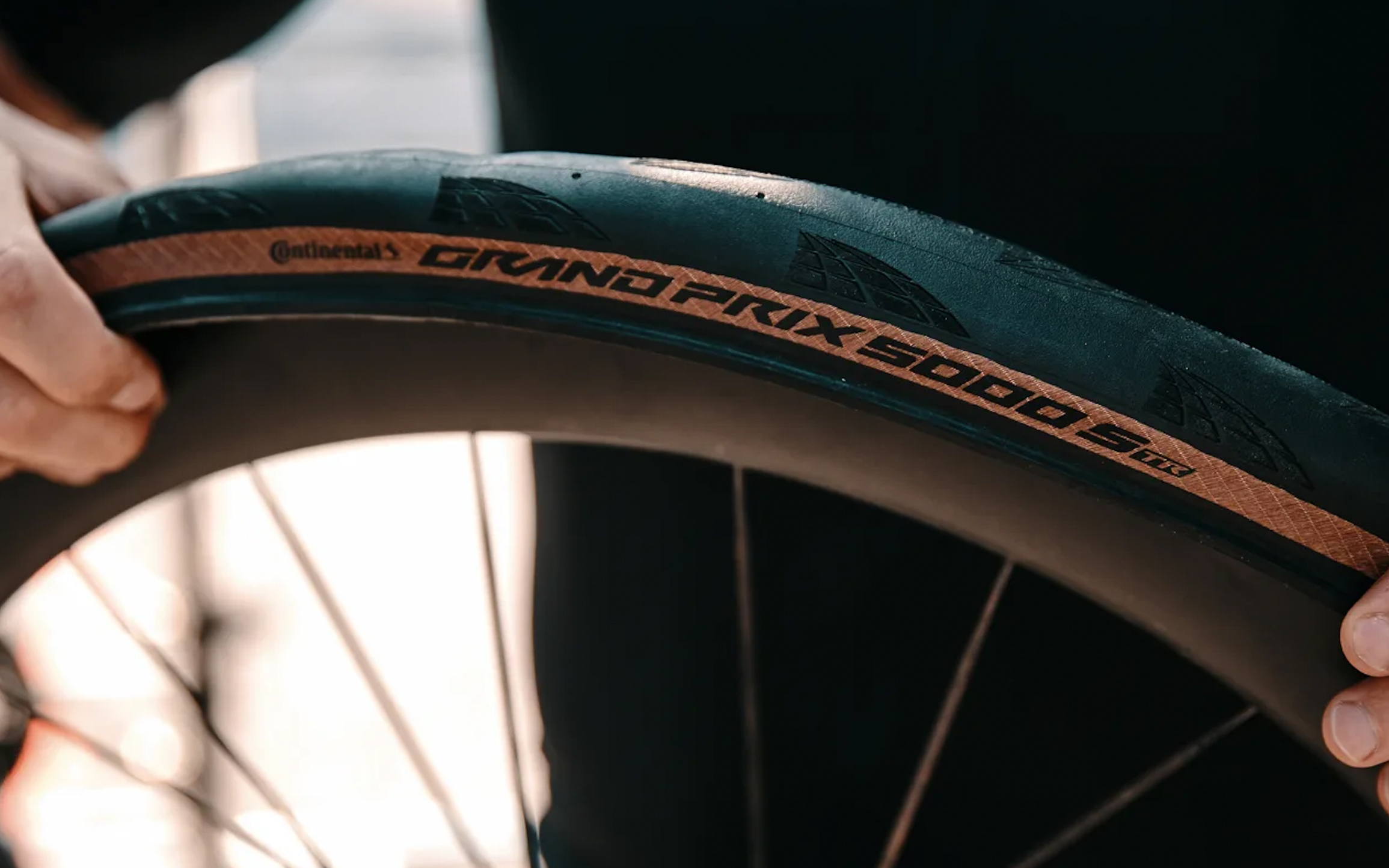 Continental GP5000S TR tyre being fitted on a wheel